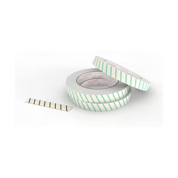 The image shows three rolls of autoclave steam sterilisation tape that is used as a validation method for medical device sterilization processes in medical autoclaves and in food canneries to provide an indication and permanent record of thermal processing in batch retort canning processes. The tape is beige with green stripes that change colour to black when the tape is exposed to an appropriate steam sterilization process.